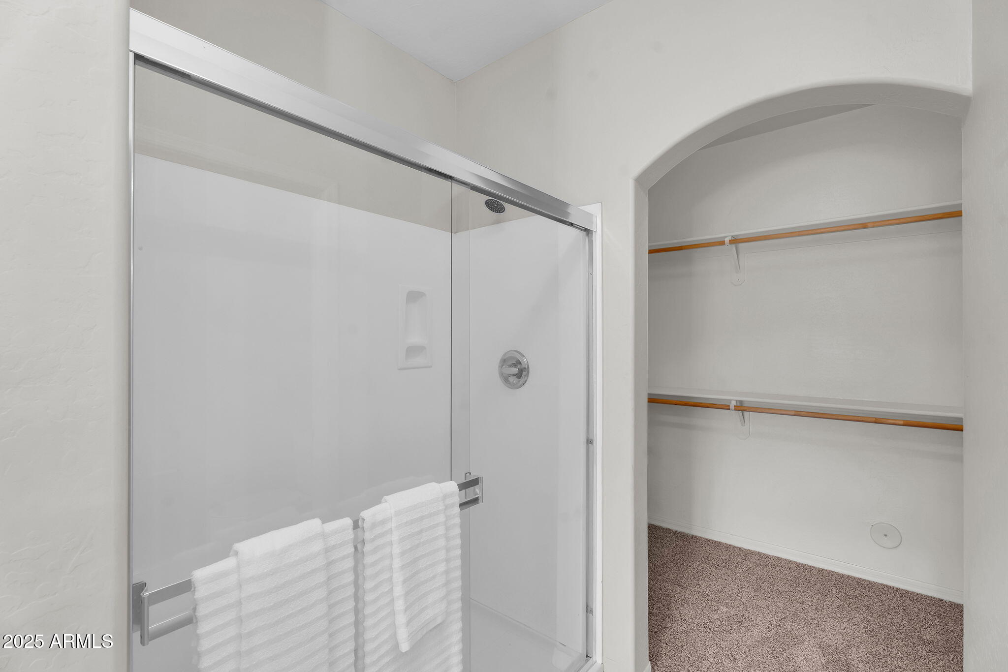 3330 South Gilbert Road, Unit 1075 Chandler, AZ 85286 - Photo 28 of 70 a bathroom with a glass shower door