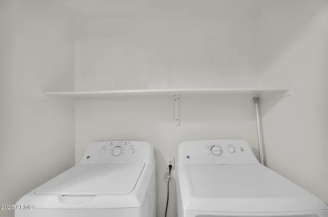 a view of a house with swimming pool and sitting area