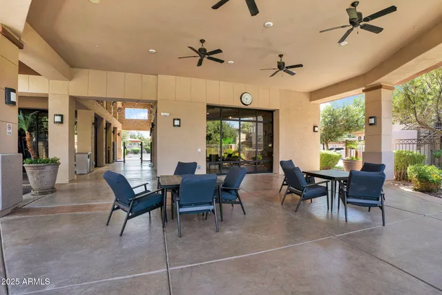 a dining room with furniture a rug and a large window
