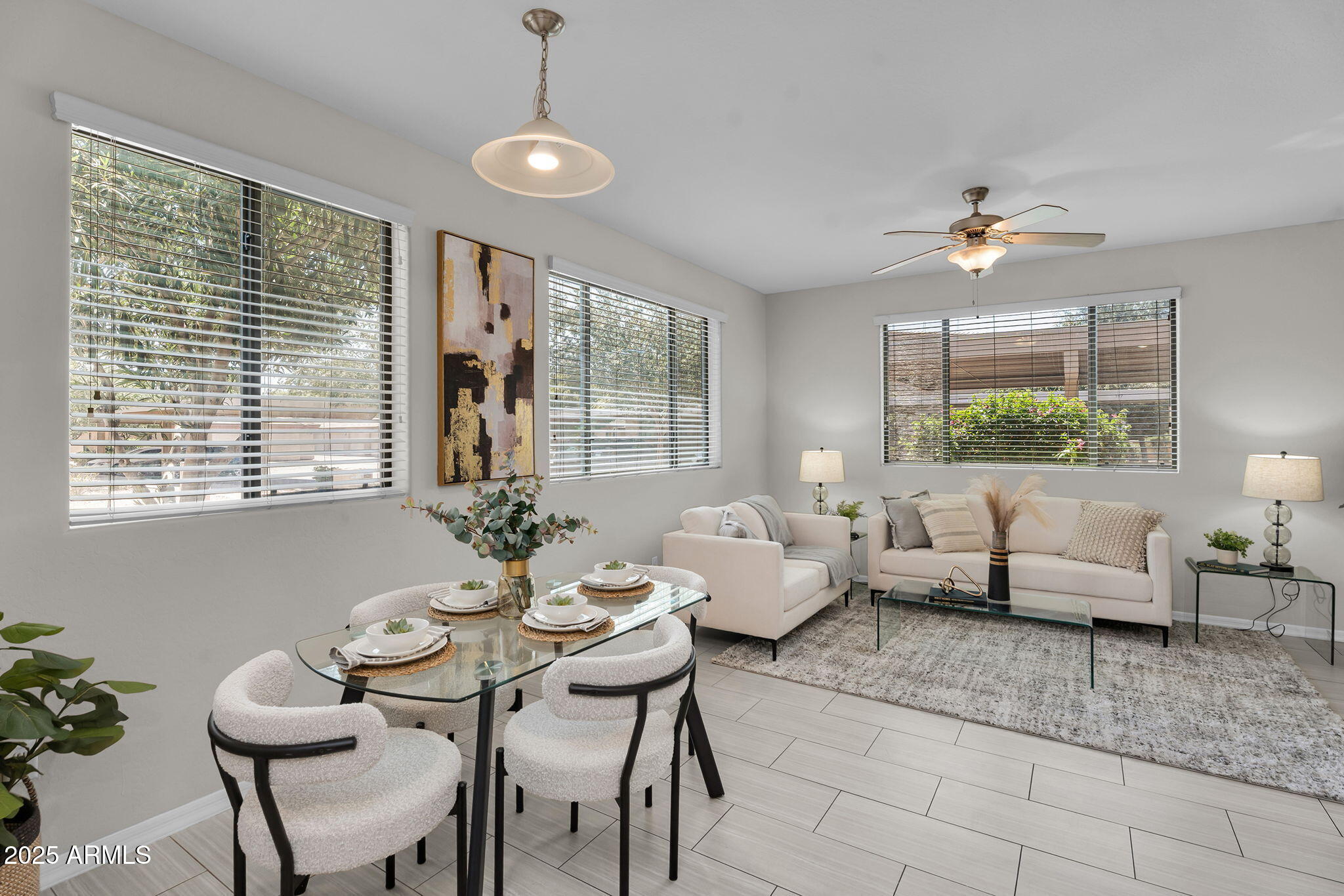 3330 South Gilbert Road, Unit 1075 Chandler, AZ 85286 - Photo 4 of 70 a living room with furniture and a chandelier