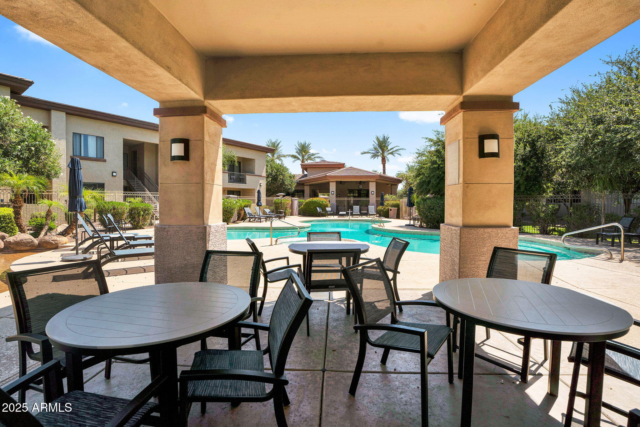 3330 South Gilbert Road, Unit 1075 Chandler, AZ 85286 - Photo 55 of 70 a view of a patio with table and chairs and potted plants