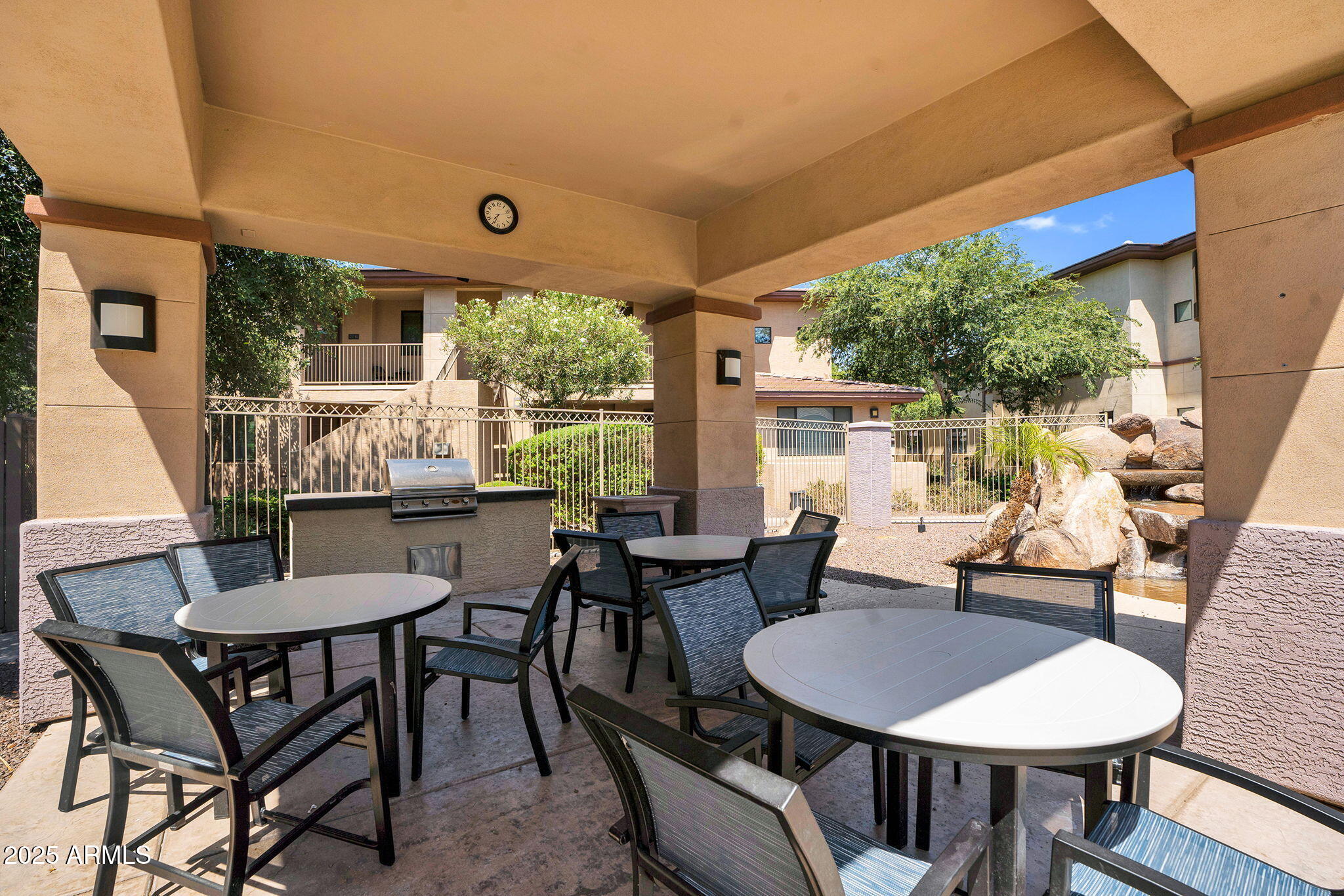 3330 South Gilbert Road, Unit 1075 Chandler, AZ 85286 - Photo 56 of 70 a dining room with furniture a rug and a large window