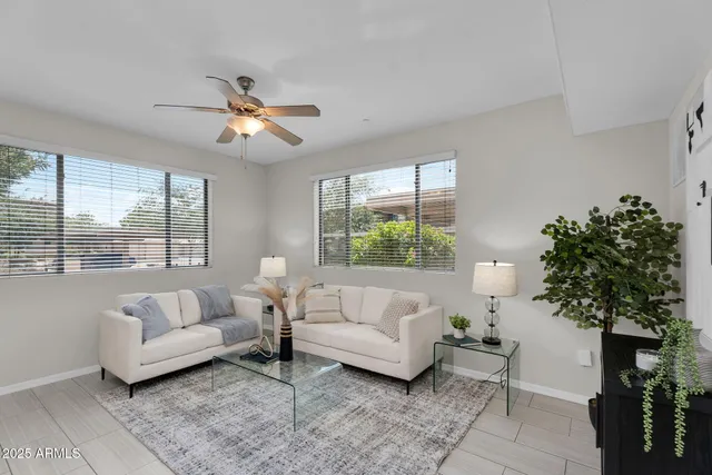 a living room with furniture and a large window