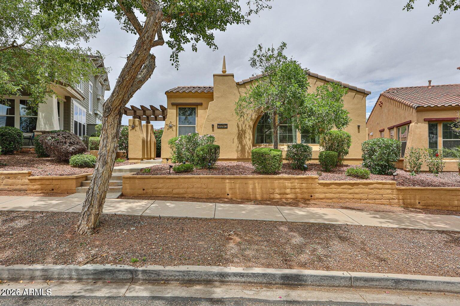 3950 North Edith Way Buckeye, AZ 85396 - Photo 2 of 32 a front view of a house with garden