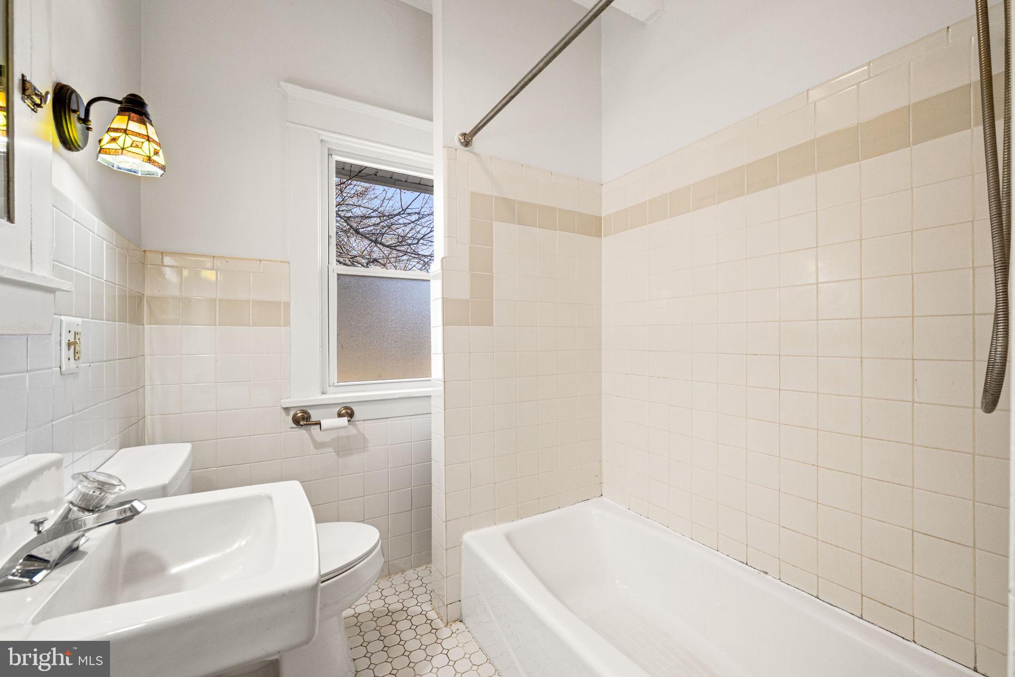 1026 Hares Hill Road Phoenixville, PA 19460 - Photo 16 of 27 a bathroom with a sink a toilet and shower