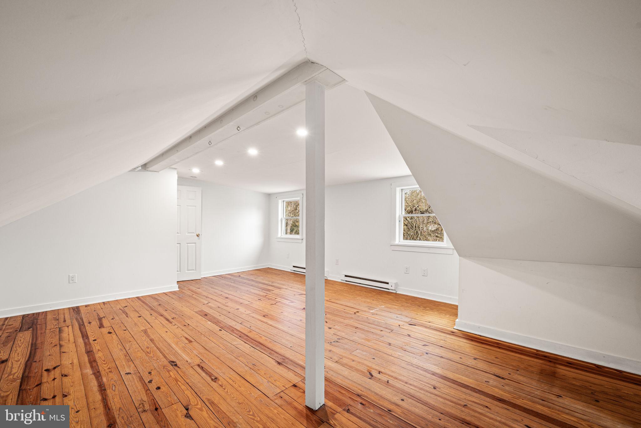 1026 Hares Hill Road Phoenixville, PA 19460 - Photo 20 of 27 a view of a big room with wooden floor and staircase