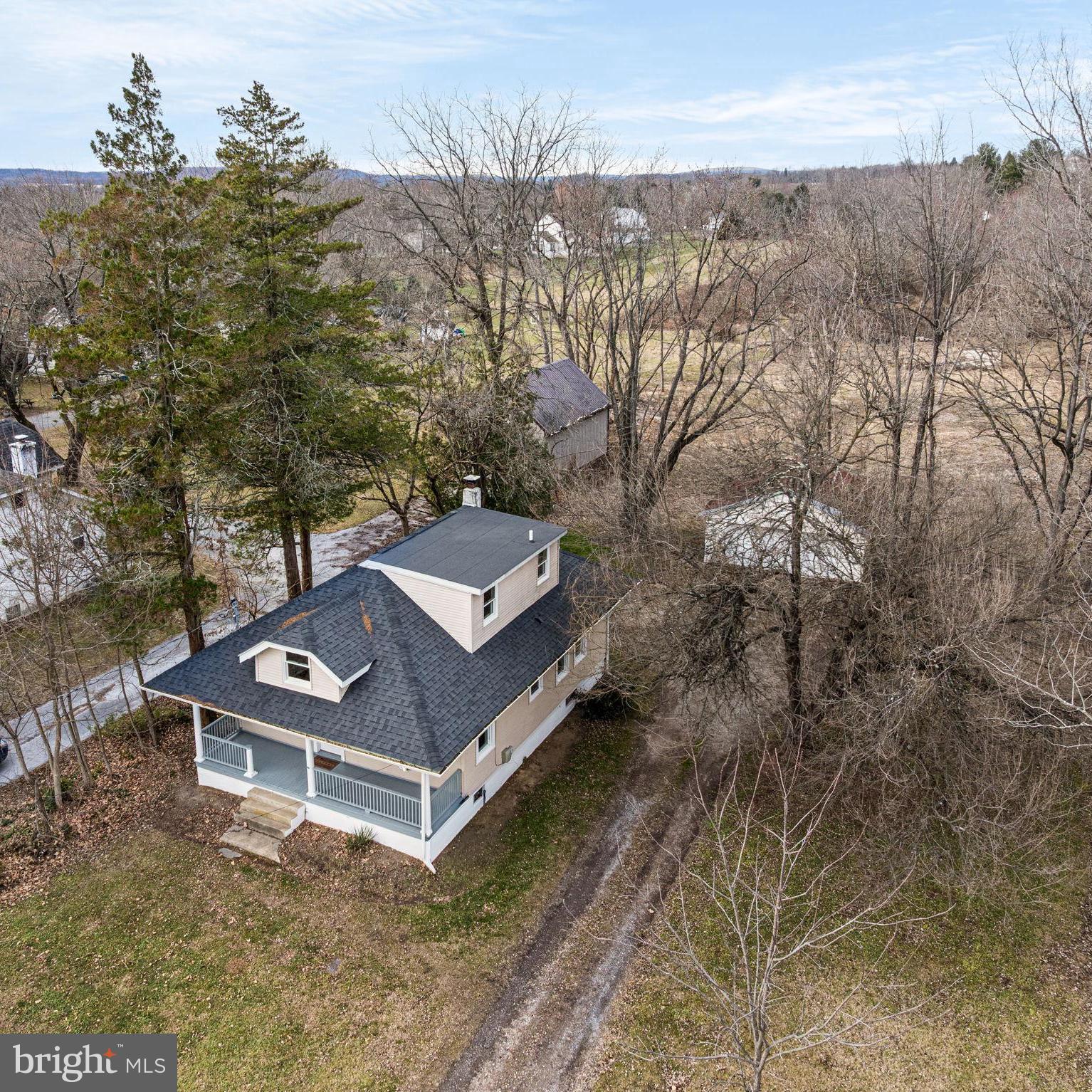 1026 Hares Hill Road Phoenixville, PA 19460 - Photo 2 of 27 a view of a roof deck with wooden fence and wooden floor