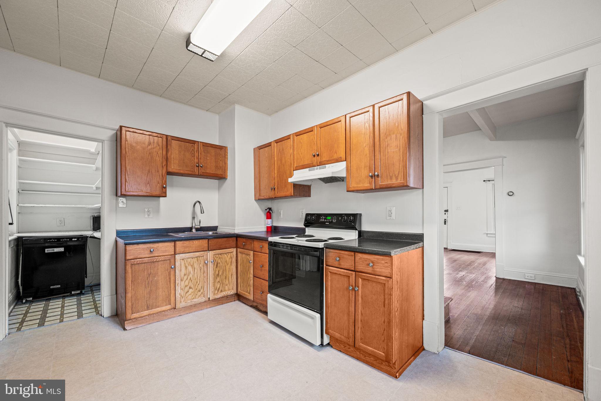 1026 Hares Hill Road Phoenixville, PA 19460 - Photo 10 of 27 a kitchen with stainless steel appliances granite countertop a stove sink and cabinets