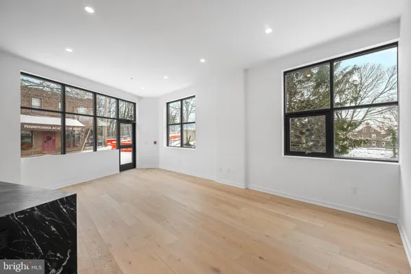 a view of an empty room with a window