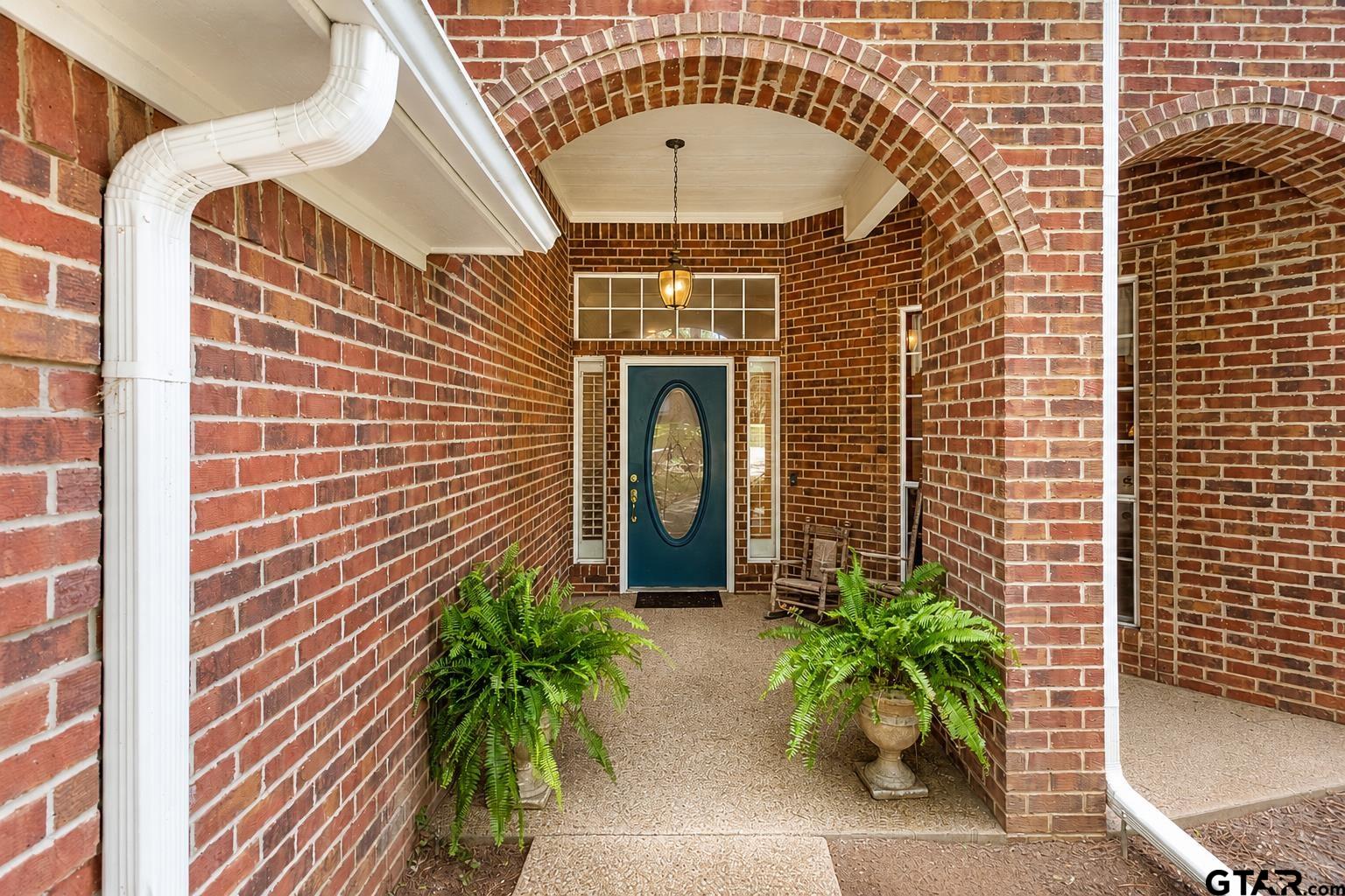 1388 Santa Fe Trail Tyler, TX 75703 - Photo 4 of 46 a front view of a house with a garden