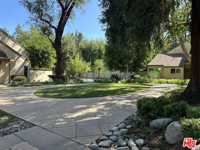 a view of a fountain in front of a house