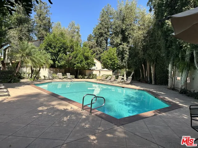 a view of a park with large trees