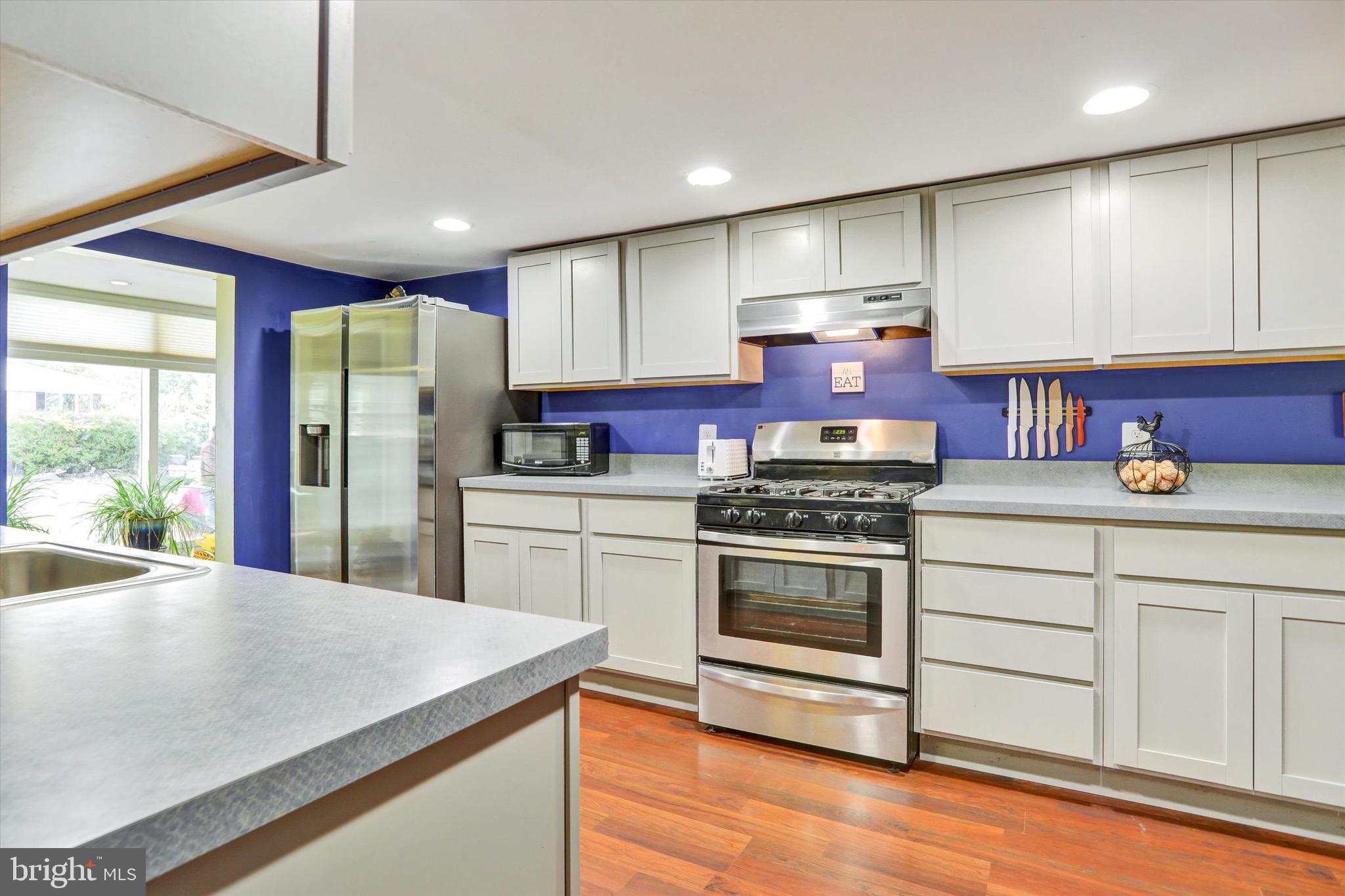 220 West Timonium Road Lutherville-Timonium, MD 21093 - Photo 15 of 64 a kitchen with a stove a sink and a refrigerator