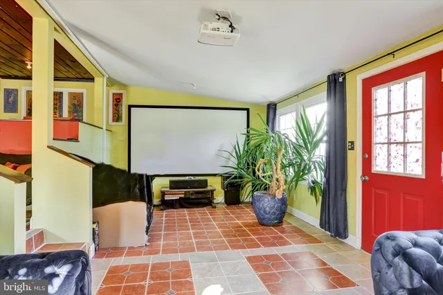 a vase of flowers sitting on a table with window