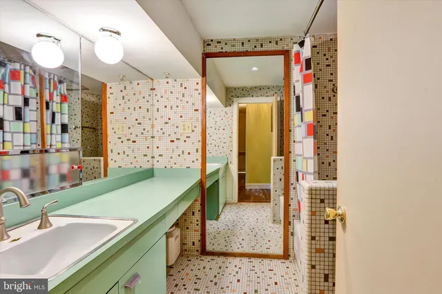 a front view of a house with a yard fire pit and outdoor seating