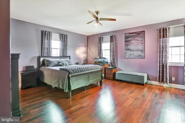 a view of a backyard with sitting area and garden