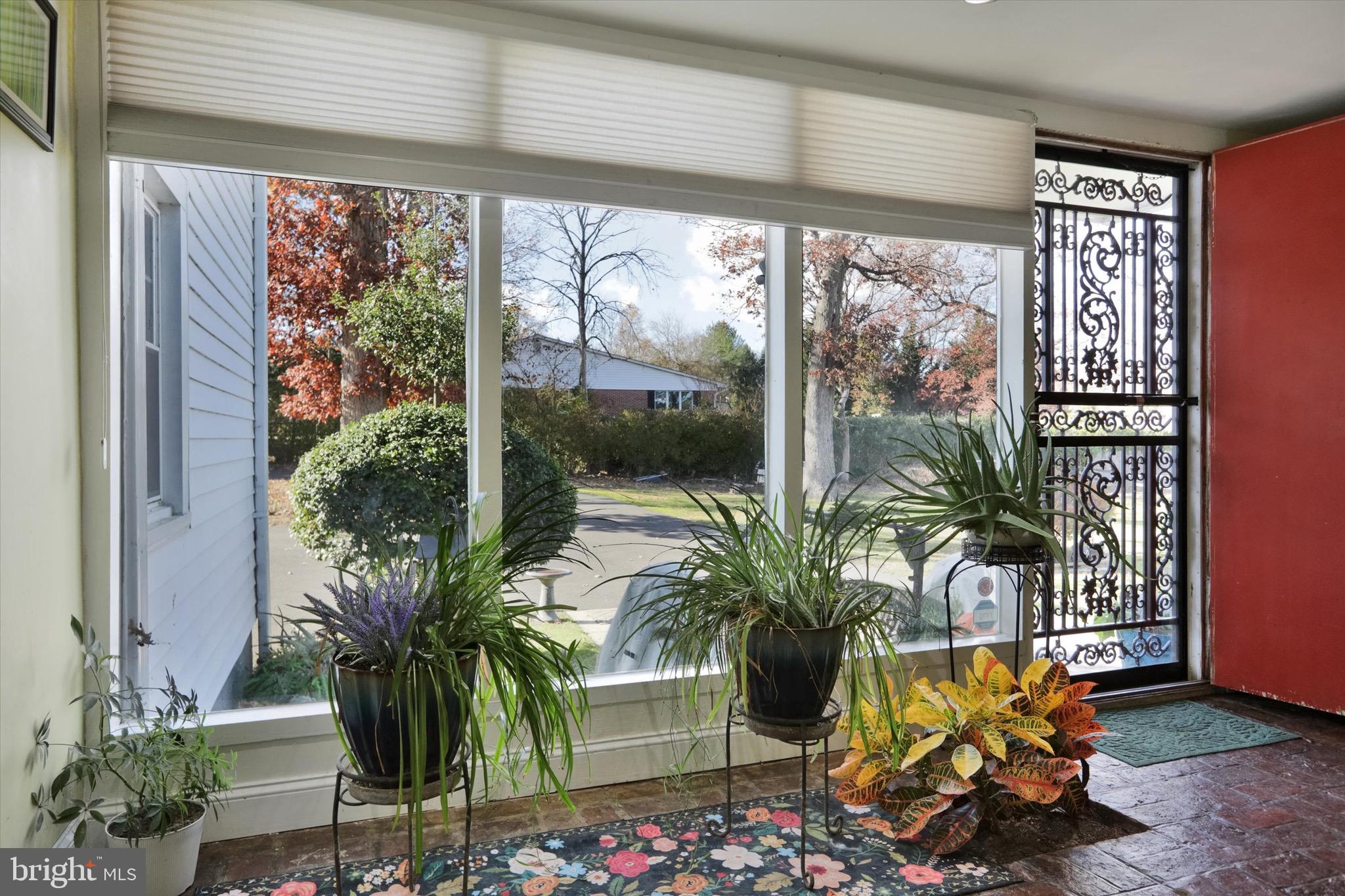 220 West Timonium Road Lutherville-Timonium, MD 21093 - Photo 44 of 64 a vase of flowers sitting on a table with window