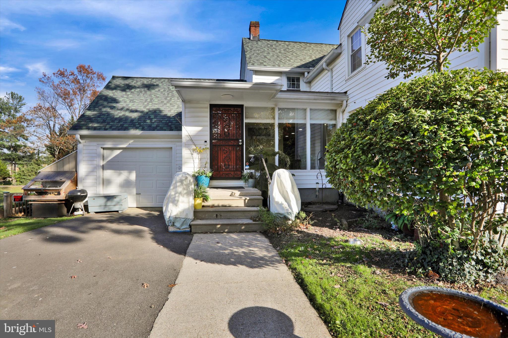 220 West Timonium Road Lutherville-Timonium, MD 21093 - Photo 45 of 64 a front view of a house with a yard fire pit and outdoor seating