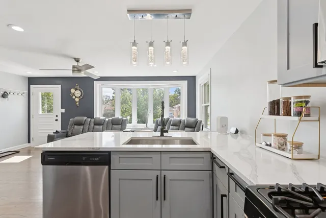 a kitchen with sink and stove