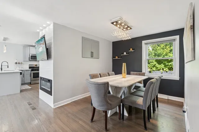 a view of a dining room with furniture window and wooden floor