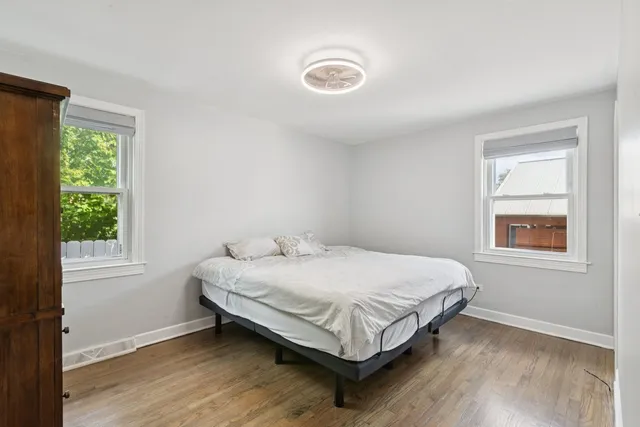 a bedroom with a bed and window