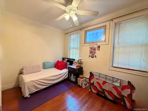 a bedroom with furniture and a window