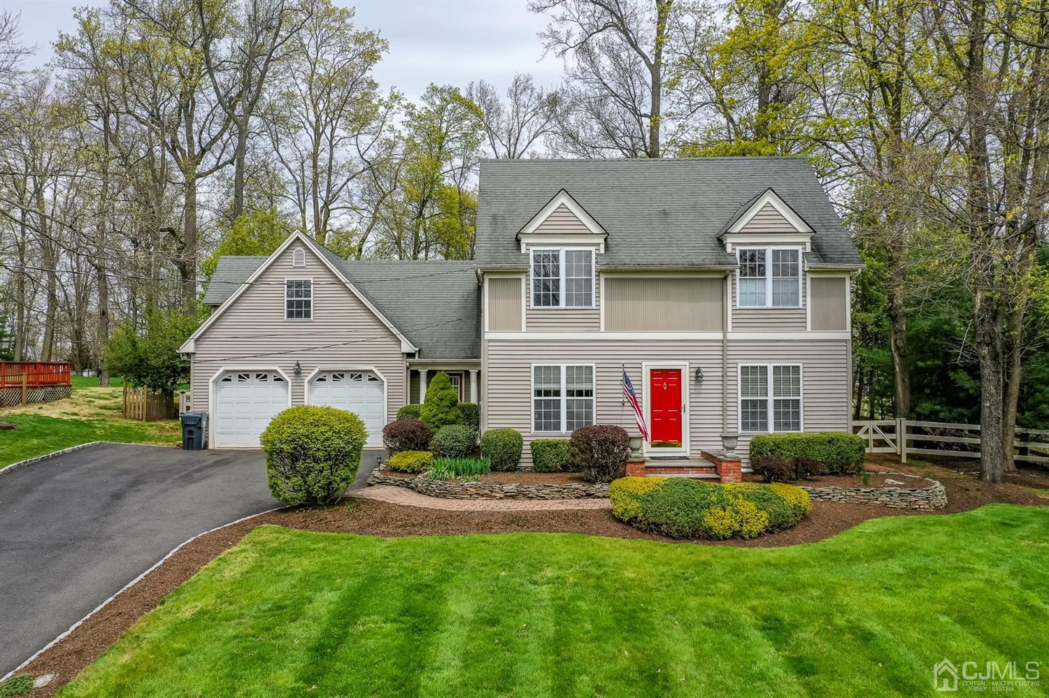 a view of a house with a yard and plants
