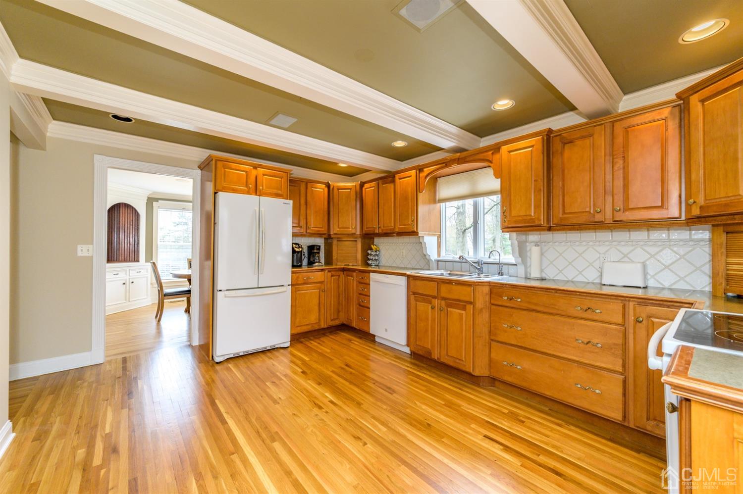 36 Cedar Grove Road Branchburg, NJ 08876 - Photo 11 of 51 a kitchen with granite countertop wooden floors a stove and a refrigerator