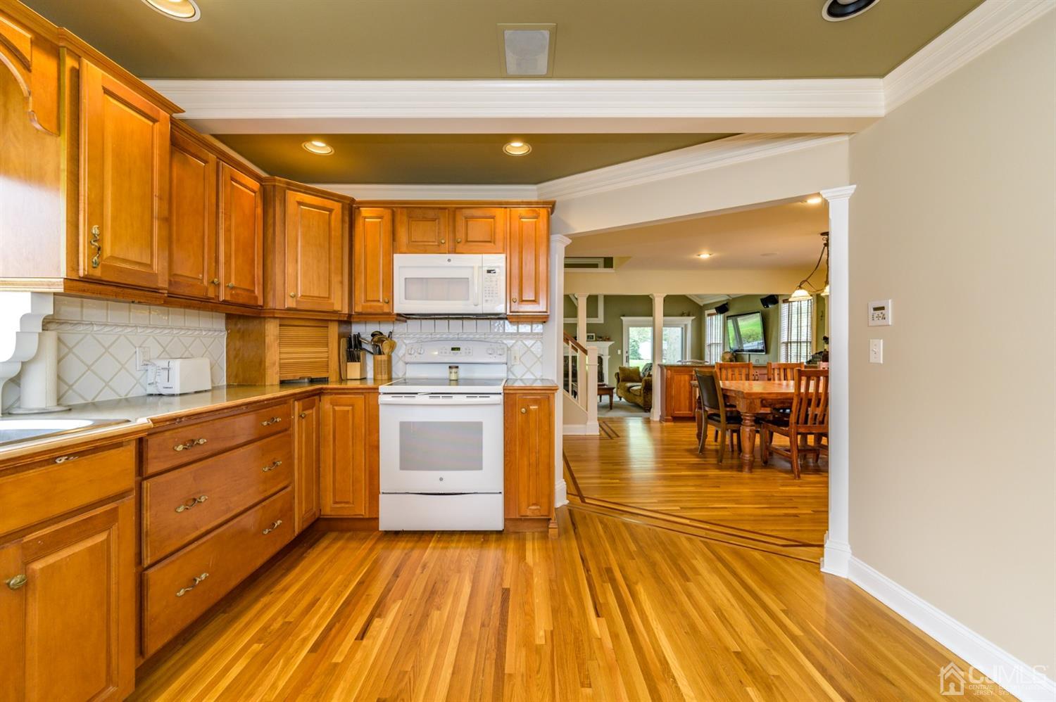36 Cedar Grove Road Branchburg, NJ 08876 - Photo 12 of 51 a kitchen with wooden floors and white walls