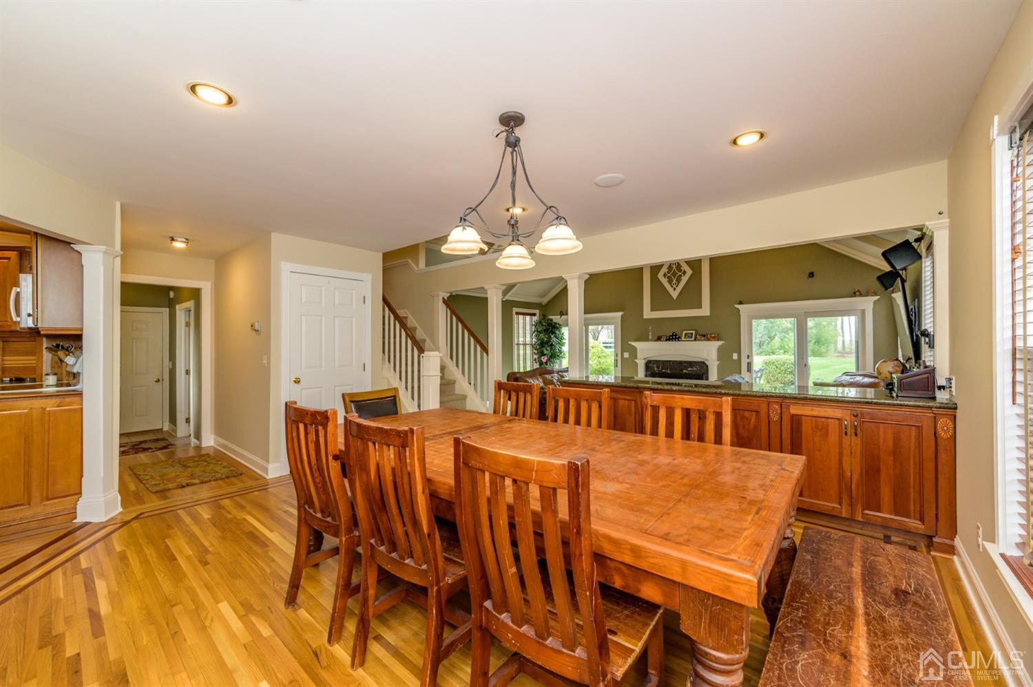 36 Cedar Grove Road Branchburg, NJ 08876 - Photo 15 of 51 a dining room with furniture a chandelier and wooden floor