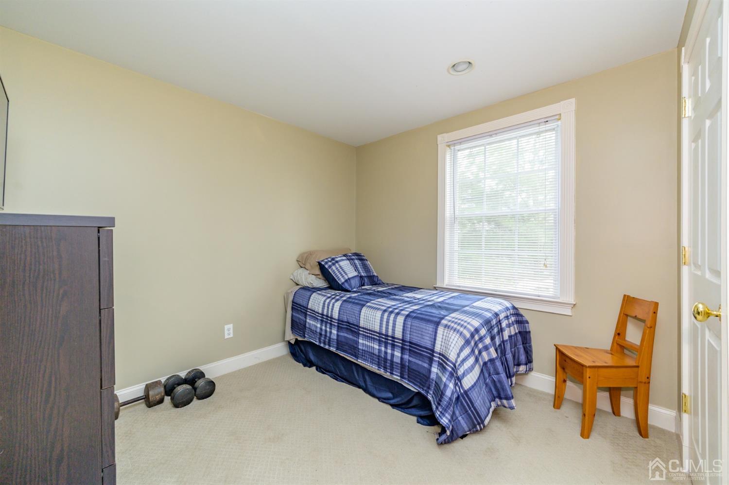 36 Cedar Grove Road Branchburg, NJ 08876 - Photo 21 of 51 a bed sitting in a bedroom next to a window