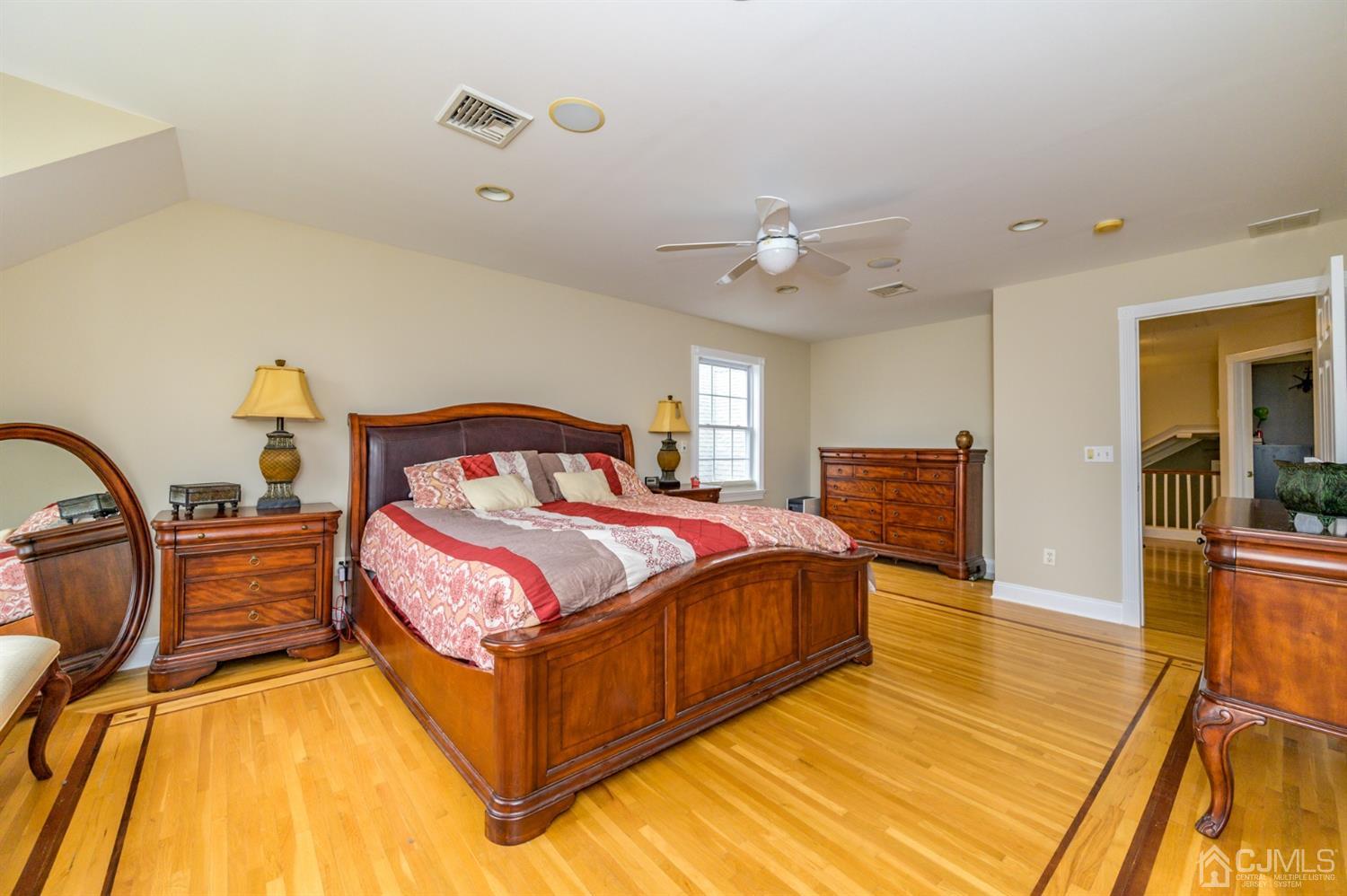 36 Cedar Grove Road Branchburg, NJ 08876 - Photo 25 of 51 a spacious bedroom with a bed and wooden floor