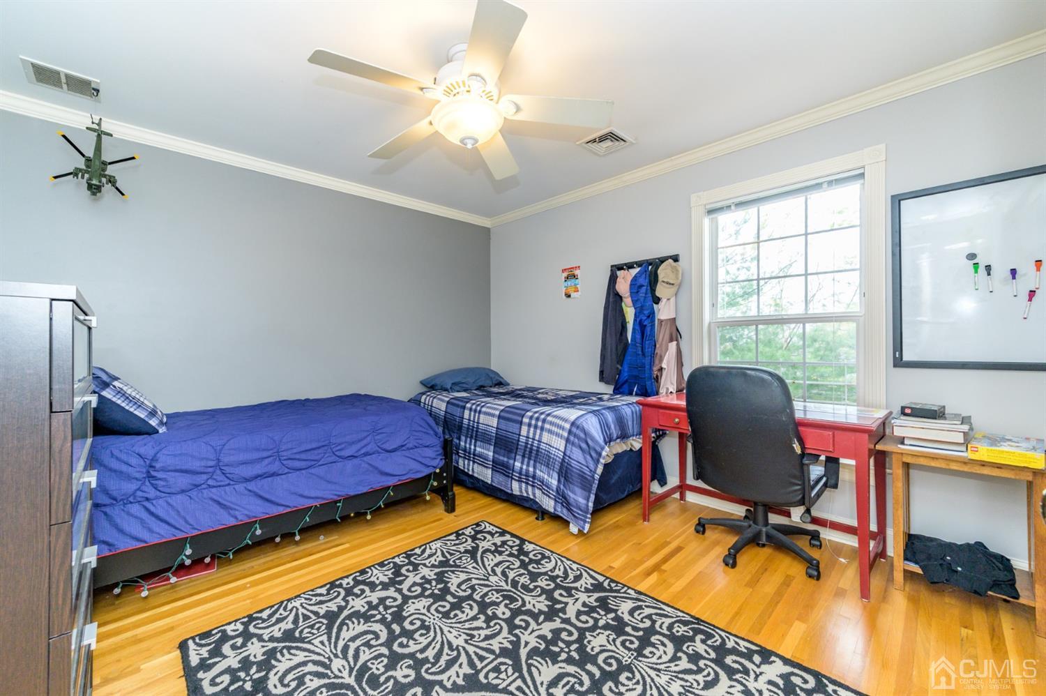 36 Cedar Grove Road Branchburg, NJ 08876 - Photo 31 of 51 a bedroom with a bed and wooden floor