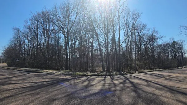 a view of space with wooden fence