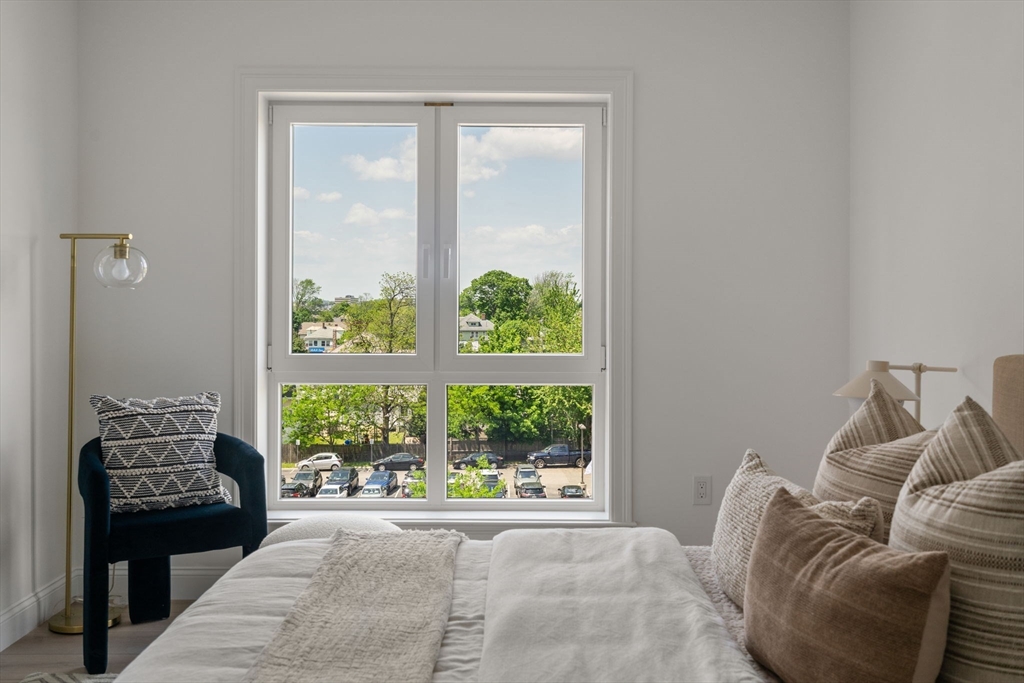 13 Wentworth Road, Unit 404 Quincy, MA 02170 - Photo 13 of 18 a living room with furniture and a window