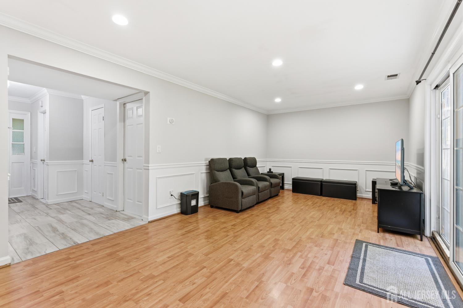 5 McKinley Street Edison, NJ 08820 - Photo 9 of 38 a living room with furniture and a flat screen tv