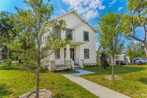 a front view of a house with garden