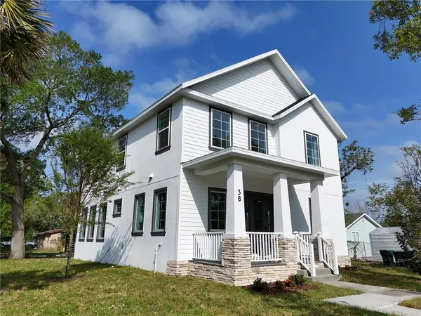 a front view of a house with a porch