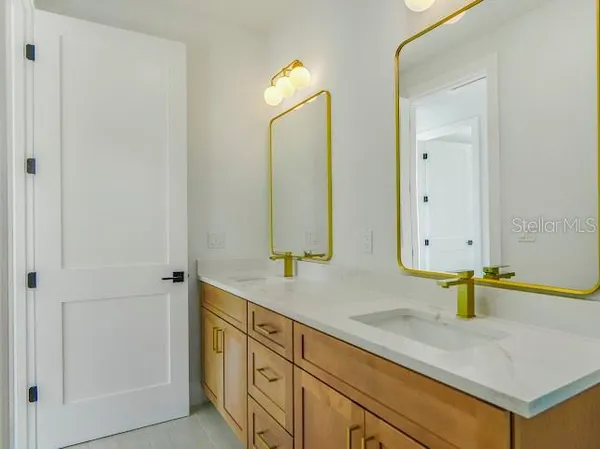 an aerial view of a house with a swimming pool