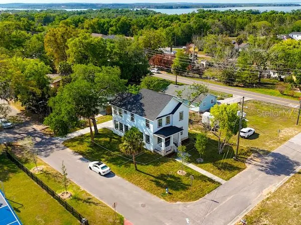 an aerial view of residential houses with outdoor space