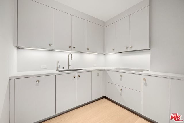 a view of an empty room and a window