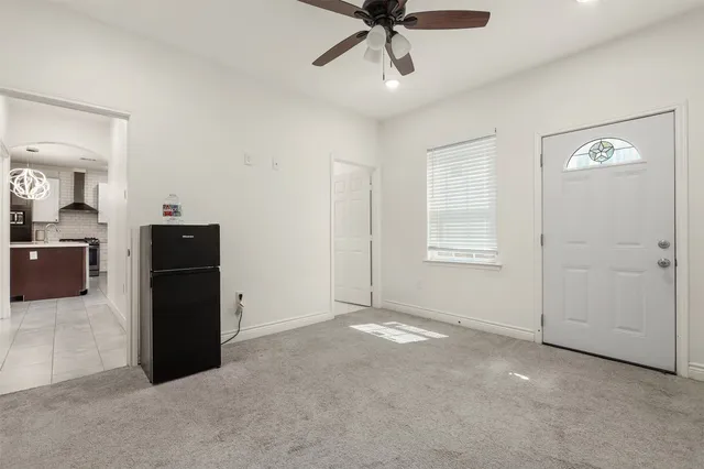 a view of a livingroom with a kitchen