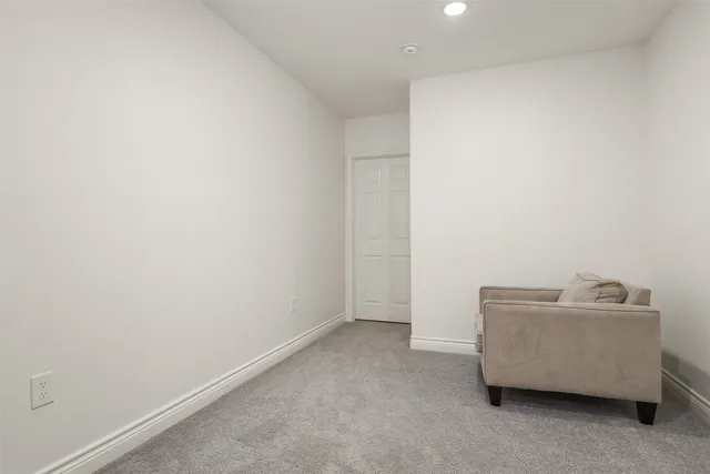 a room with a couch and a window