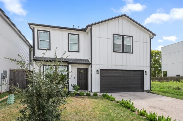a front view of a house with yard