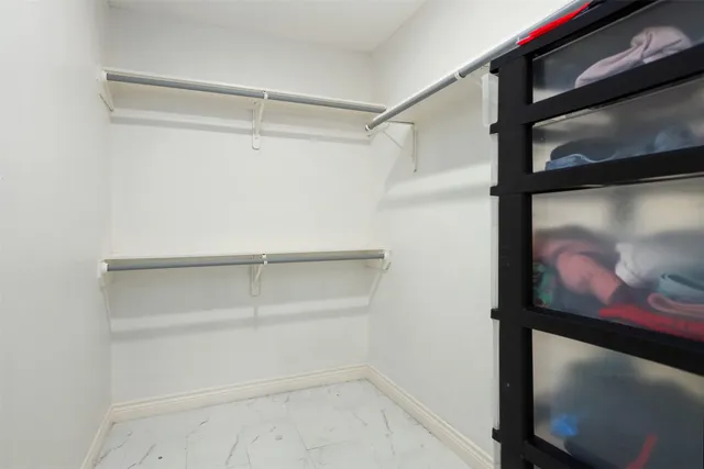 a view of an empty walk in closet