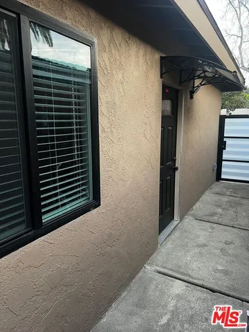 a view of a house with a street