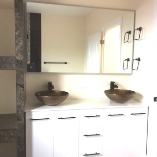 11633 South Avenue H Chicago, IL 60617 - Photo 41 of 57 a bathroom with a sink and a mirror