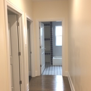 11633 South Avenue H Chicago, IL 60617 - Photo 45 of 57 a view of a hallway with wooden floor and staircase