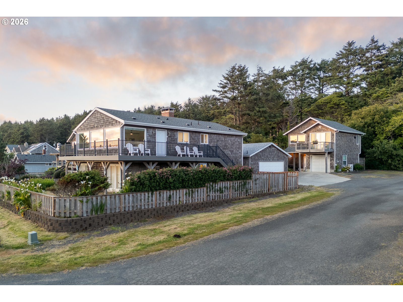 3087 South Hemlock Street Cannon Beach, OR 97110 - Photo 1 of 48 a view of houses with a swimming pool and a yard