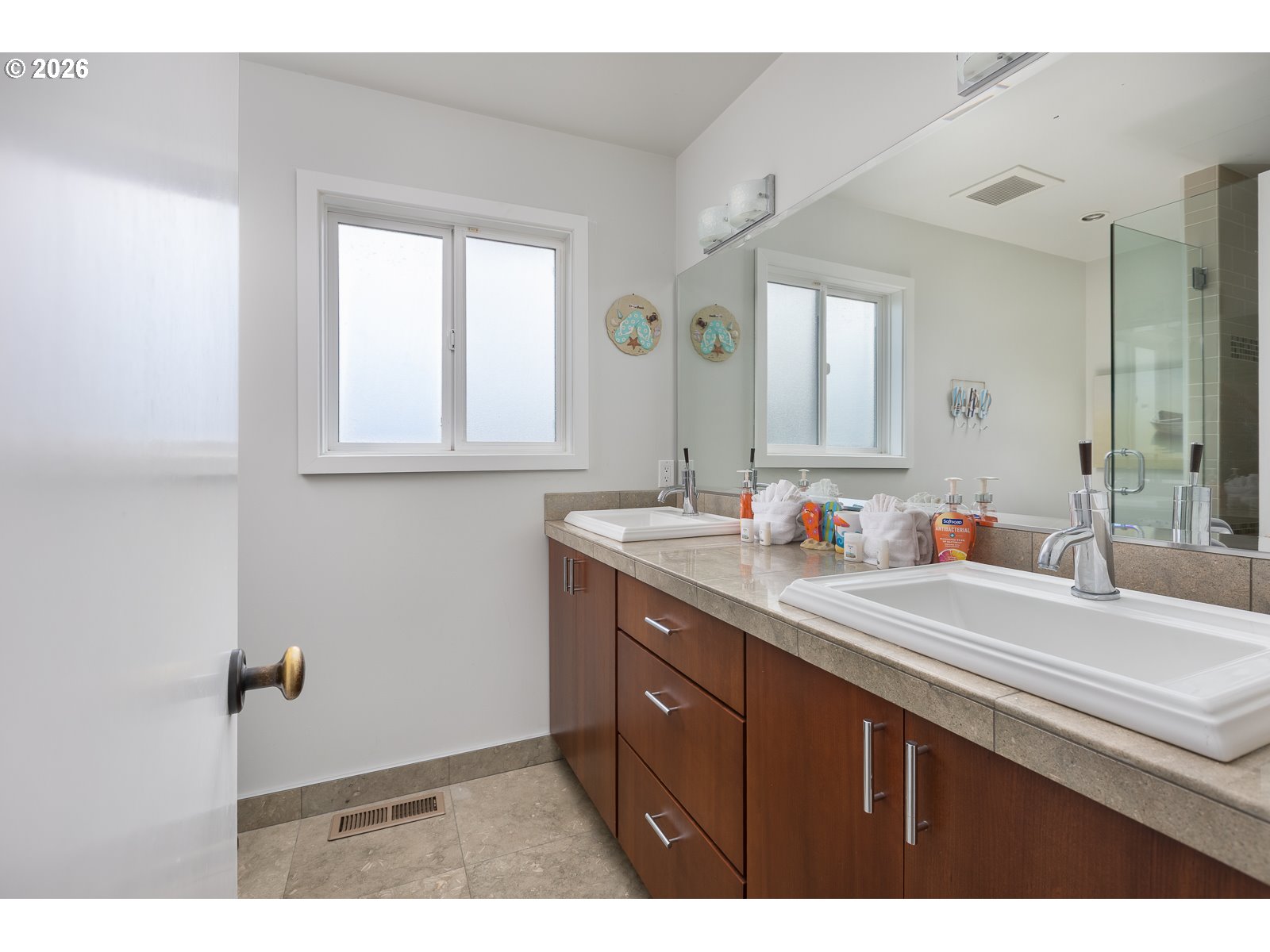 3087 South Hemlock Street Cannon Beach, OR 97110 - Photo 15 of 48 a bathroom with a sink and a mirror
